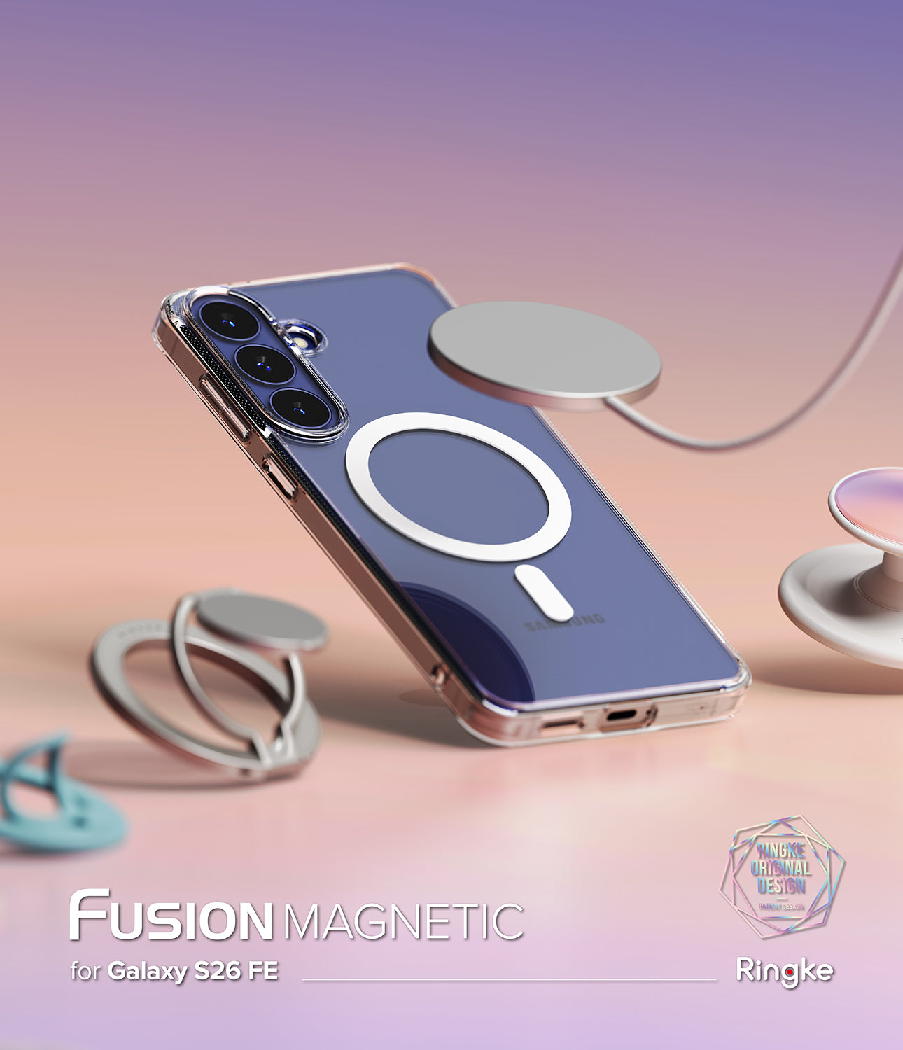 Galaxy S26 FE Case | Fusion Magnetic - A clear magnetic phone case with a white circular MagSafe ring and a silver metal ring grip, shown on a blue smartphone. The case is displayed in a floating pose with other matching magnetic accessories on a pastel pink and purple background.