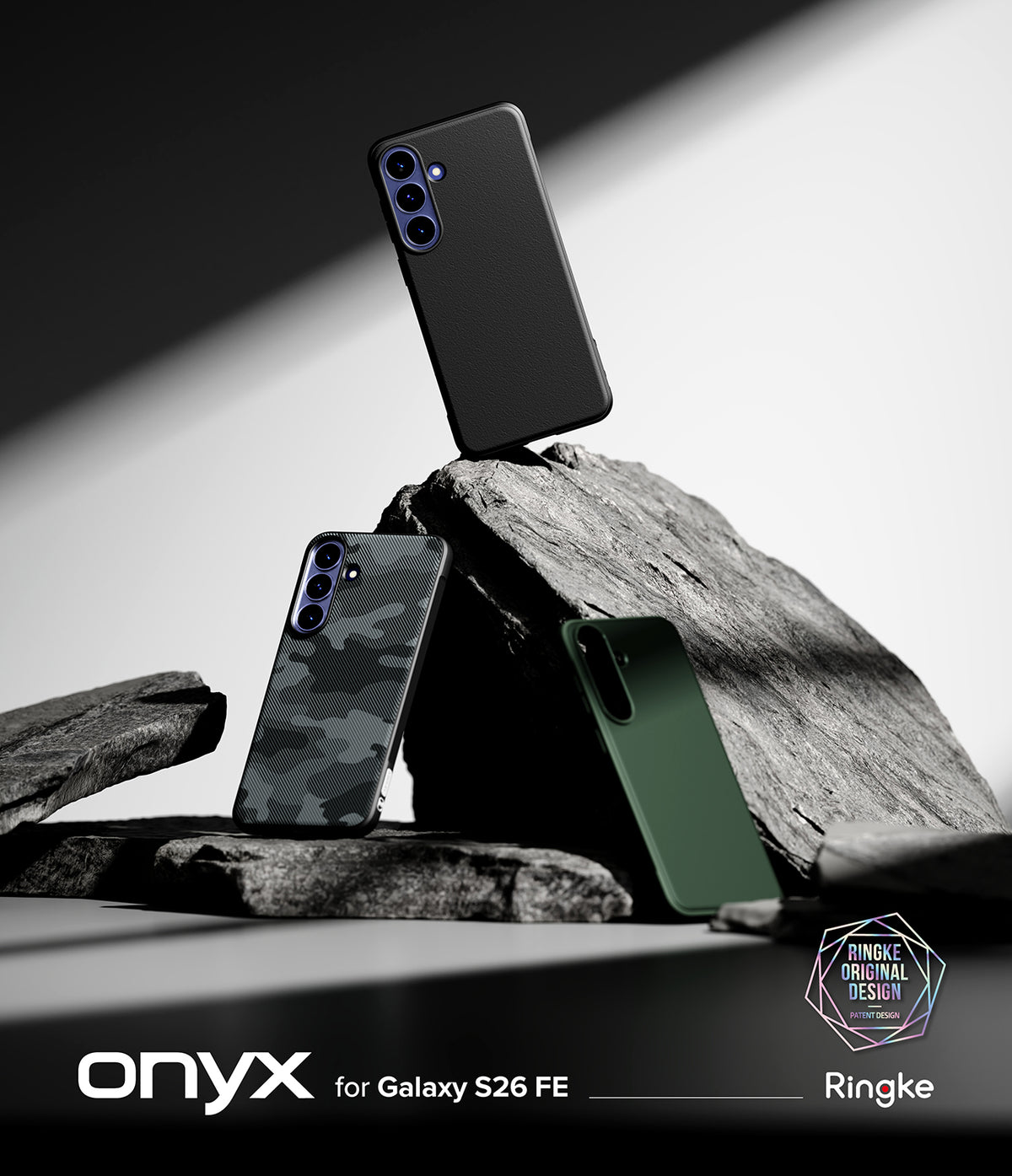 Galaxy S26 FE Case | Onyx - Three phone cases displayed on dark rocks: a matte black case standing upright, a dark gray camouflage case leaning in front, and a forest green case resting beside it. The image includes the text 'onyx for Galaxy S26 FE' and a Ringke logo badge.