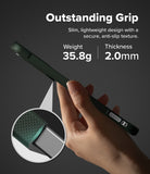 Galaxy S26 FE Case | Onyx - A hand holds a dark green textured phone case against a dark gray background, with promotional text reading 'Outstanding Grip' and a circular inset showing the textured grip detail.