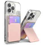 Card Holder | Stand Slot - Two clear phone cases with pink card holder attachments, one folded flat and one acting as a kickstand.