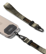 Holder Link Tactical Webbing Hand Strap - Olive green tactical webbing strap with black carabiner clips attached to a phone.