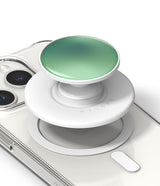 Ringke Glossy Tok Magnetic - A white magnetic phone grip with a glossy green top attached to a clear smartphone case.