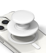 Ringke Glossy Tok Magnetic - A white magnetic phone grip hovering above a clear smartphone case with a magnetic ring.