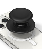 Ringke Tok Magnetic - A black, circular magnetic phone grip attached to the back of a clear smartphone case.