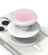 Ringke Tok Magnetic - A white magnetic phone grip with a pink top, hovering above a clear phone case on a white background.