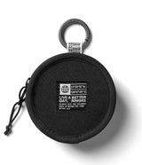 Mini Pouch | Tambourine Bag - Black circular pouch with a carabiner, zipper pull, and a branded patch featuring coordinates.
