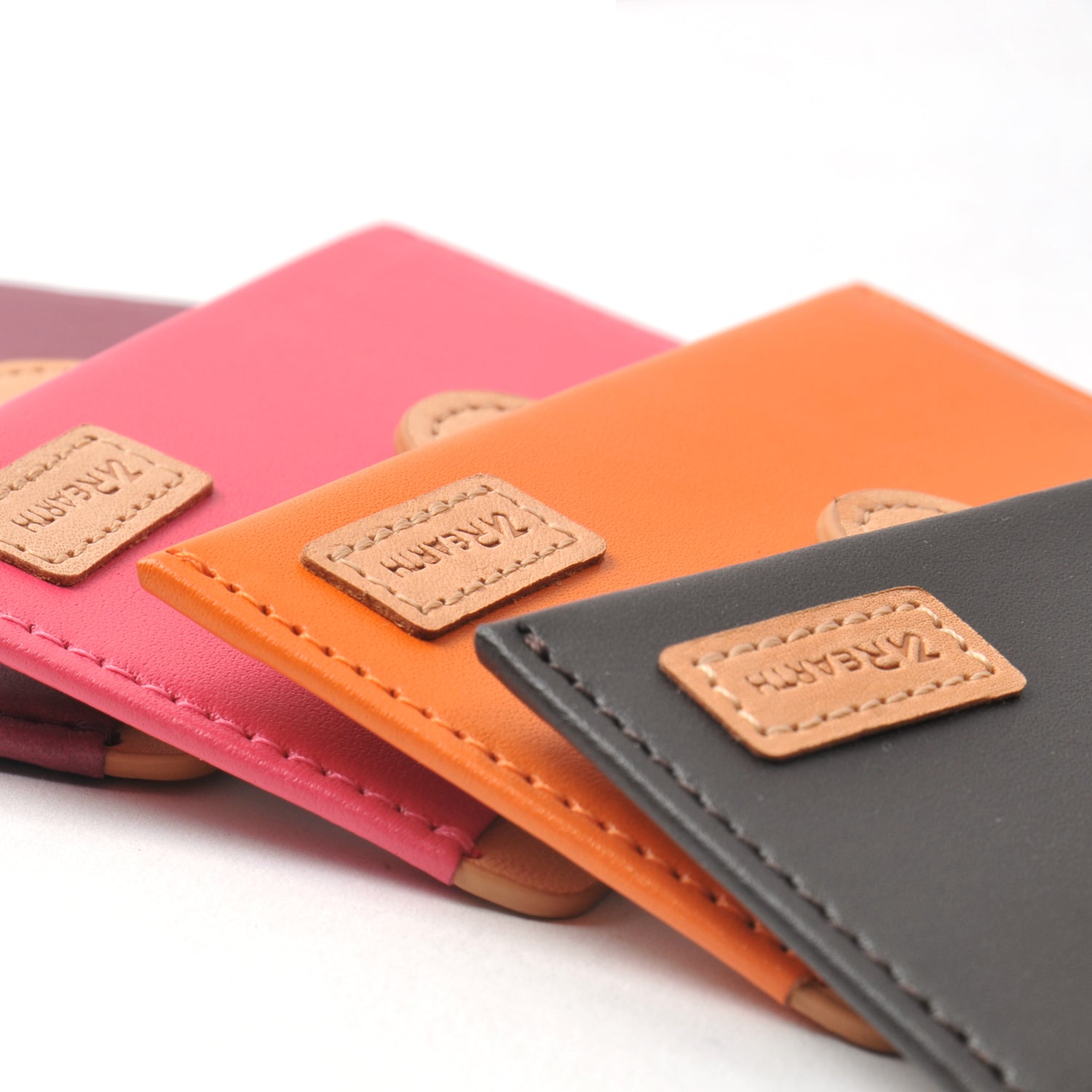 Ringke® Leather ID / Card Holder, 3M Adhesive Stick On Mini Wallet Attachment for All Phone Devices - Ringke® Leather ID / Card Holder - Stack of colorful leather adhesive card holders with stitched logo patches.