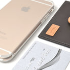 Ringke® Leather ID / Card Holder, 3M Adhesive Stick On Mini Wallet Attachment for All Phone Devices - Ringke® Leather ID / Card Holder - A gold smartphone, a dark brown leather card holder, and a silver credit card on white.