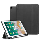 Smart Cover Apple Pencil Stand | iPad - A dark gray tri-fold tablet case shown with a tablet in front, standing in landscape orientation on its kickstand. The back cover of the case is shown upright behind it.